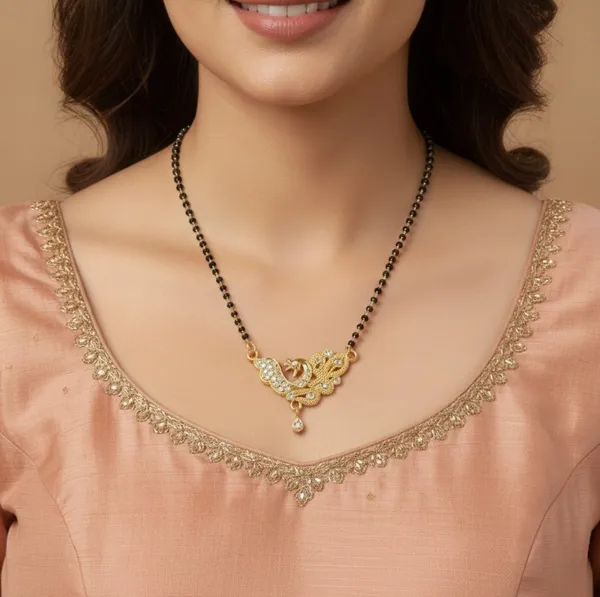 Elegant_gold-tone_mangalsutra_featuring_a_peacock-inspired_pendant