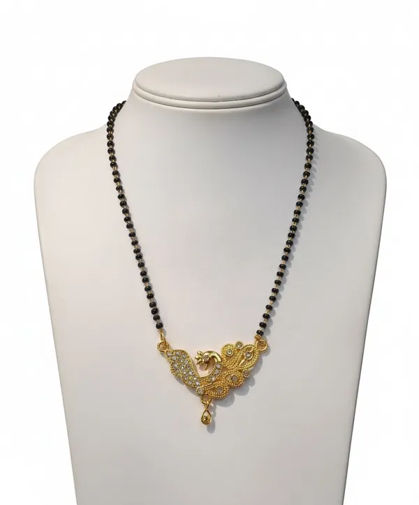 Elegant_gold-tone_mangalsutra_featuring_a_peacock-inspired_pendant