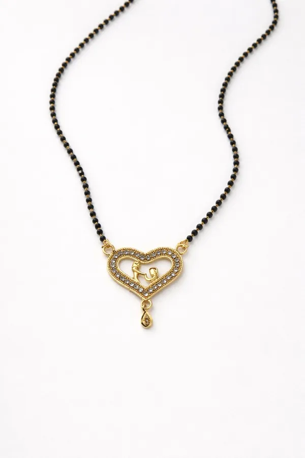 single-line_mangalsutra_with_black_beads_and_a_heart-shaped_gold-toned_pendant