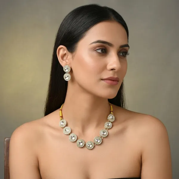 Traditional_Gold_Plated_Circular_Necklace_Set_With_Clear_Gemstones_Matching_Earrings_Ornate_Bridal_Jewellery_With_Red_Thread_Accents_Perfect_For_Weddings_Parties_Festive_Wear_Premium_Gifting_Elegant_Ethnic_Design_With_Sparkling_Stones