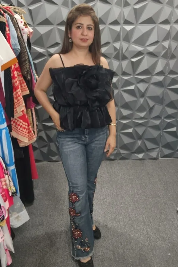 Black_Ruffled_Peplum_Top_With_Embellished_Flared_Jeans
