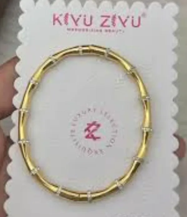 Elegant_Gold-Tone_Crystal_Accent_Bangle_Bracelet_for_Women