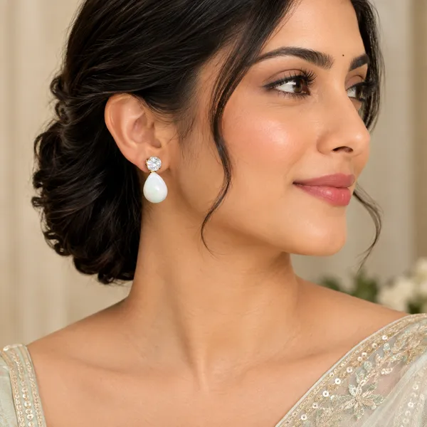 Elegant_Pear-Shaped_White_Drop_Earrings_with_Crystal-Style_Studs