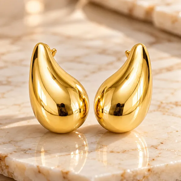Golden_Teardrop_Statement_Stud_Earrings