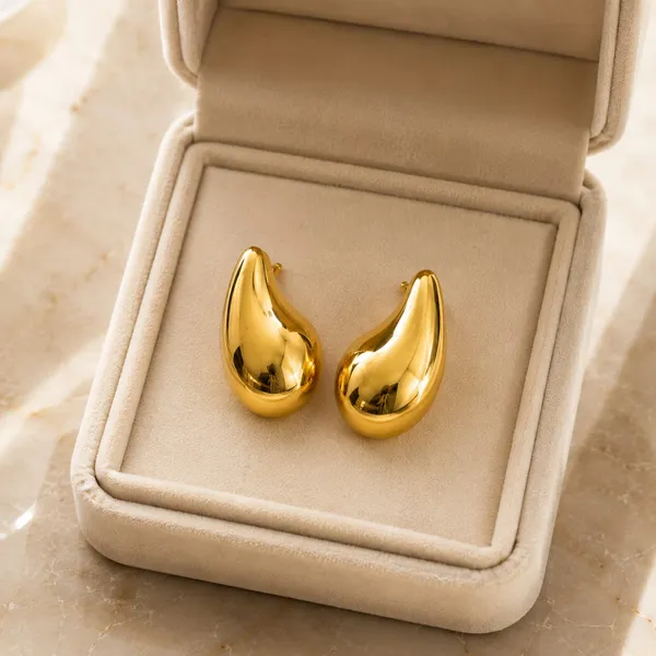 Golden_Teardrop_Statement_Stud_Earrings