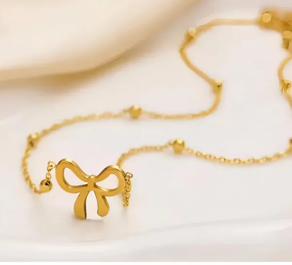 Women_Gold-Toned_Bow_Pendant_Necklace_with_Beaded_Chain