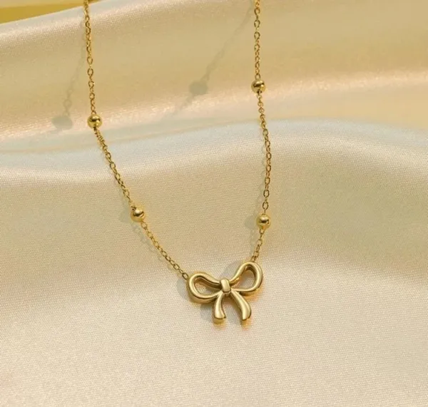 Women_Gold-Toned_Bow_Pendant_Necklace_with_Beaded_Chain
