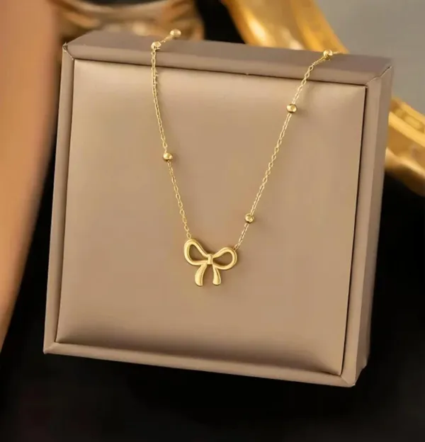 Women_Gold-Toned_Bow_Pendant_Necklace_with_Beaded_Chain