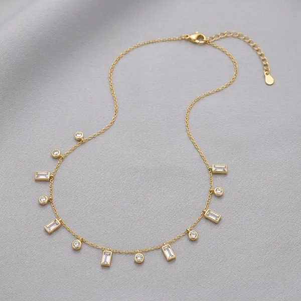 Gold_Tone_Delicate_Chain_Necklace_With_Crystal_And_Baguette_Charms