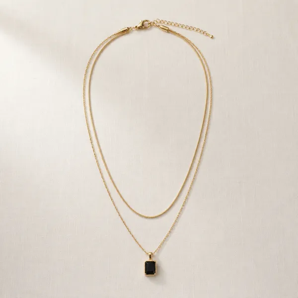 Elegant_Layered_Gold_Toned_Chain_Necklace_With_Black_Pendant