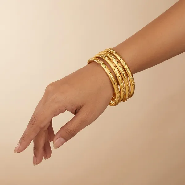 Gold_Alloy_Textured_Bangles_For_Women_(Pack_of_4_)
