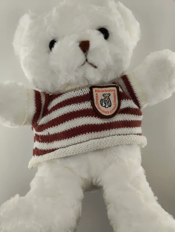 White_Teddy_Bear_With_Brown_Striped_Sweater