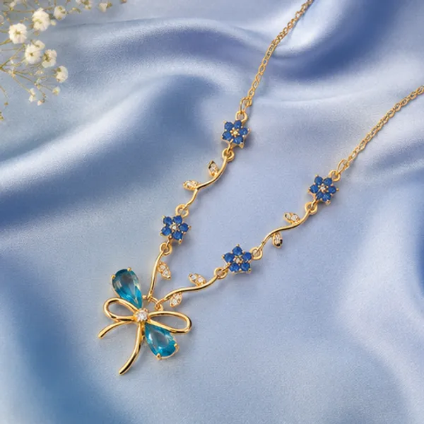 Ocean_Blossom_Tulip_&_Bow_Pendant_Necklace_–_18K_Gold_Plated_Botanical_Luxury