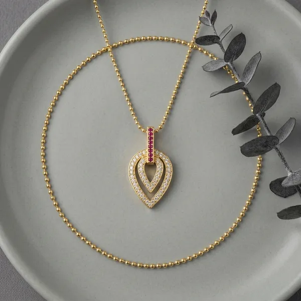 Elegant_Double_Heart_Gold_Pendant_Necklace_With_Red_Gemstones.