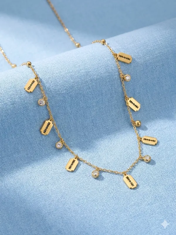 Fashionista_Razor_Blade_Gold_Necklace_With_Crystal_Drop