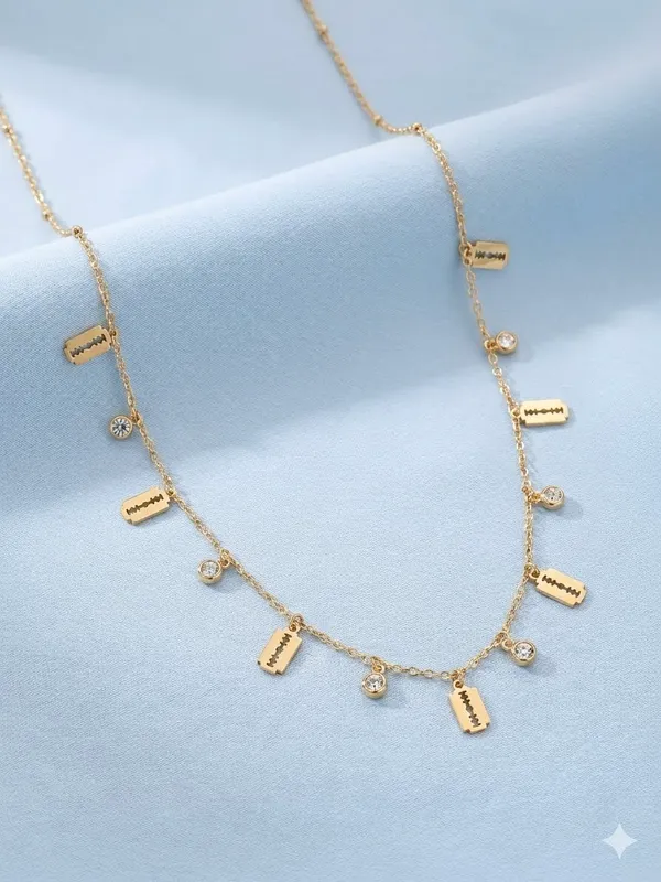 Fashionista_Razor_Blade_Gold_Necklace_With_Crystal_Drop