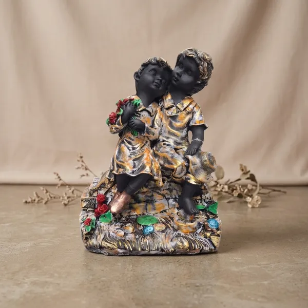 Multicolor_Boy_And_Girl_Sitting_Garden_Figurine
