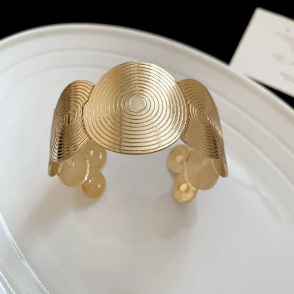 Gold-Toned_Spiral_Disc_Statement_Cuff_Bracelet