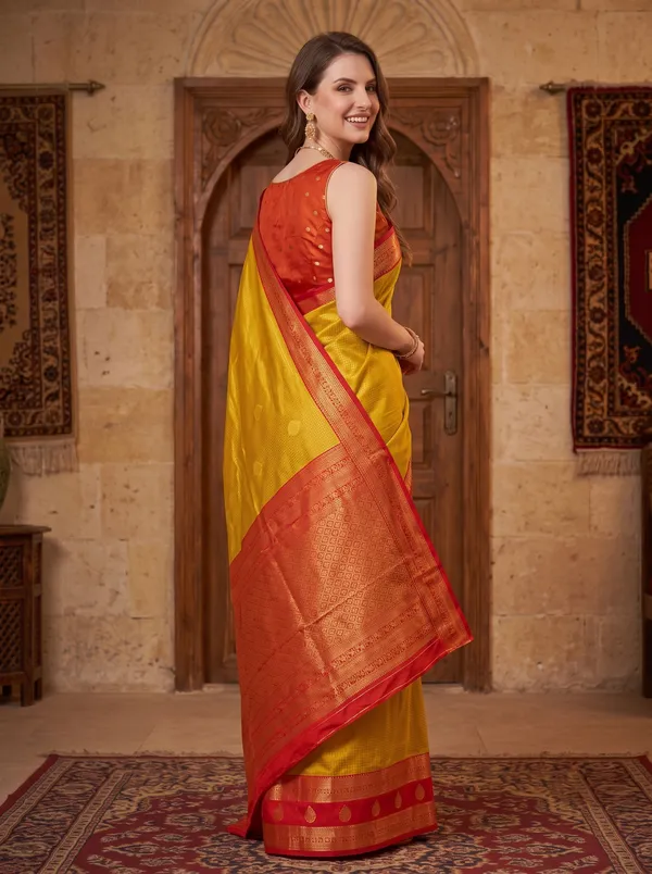 Yellow_Banarasi_Silk_Jacquard_Saree_with_Red_Border_&_Blouse
