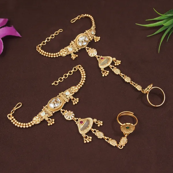 Antique_Gold_Plated_Kundan_Hathphool_With_Floral_&_Jhumka_Detailing
