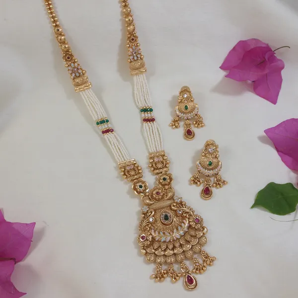 Elegant_Gold_Toned_Long_Brass_Necklace_Set_With_Pearl_Beads_And_Intricate_Temple_Design