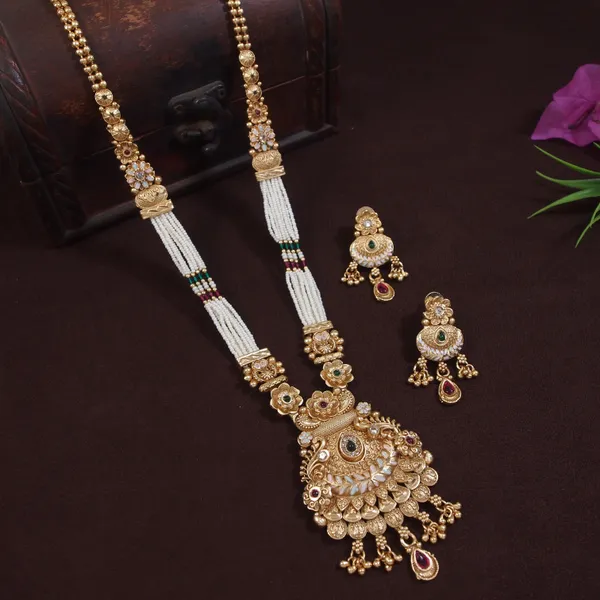 Elegant_Gold_Toned_Long_Brass_Necklace_Set_With_Pearl_Beads_And_Intricate_Temple_Design