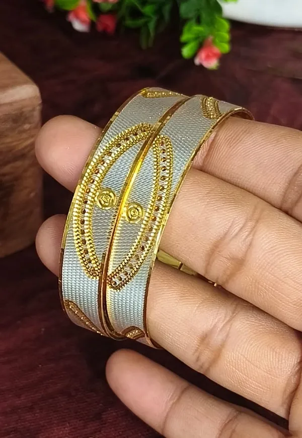 Elegant_White_And_Gold_Plated_Designer_Bangles_With_Queen_Cutout
