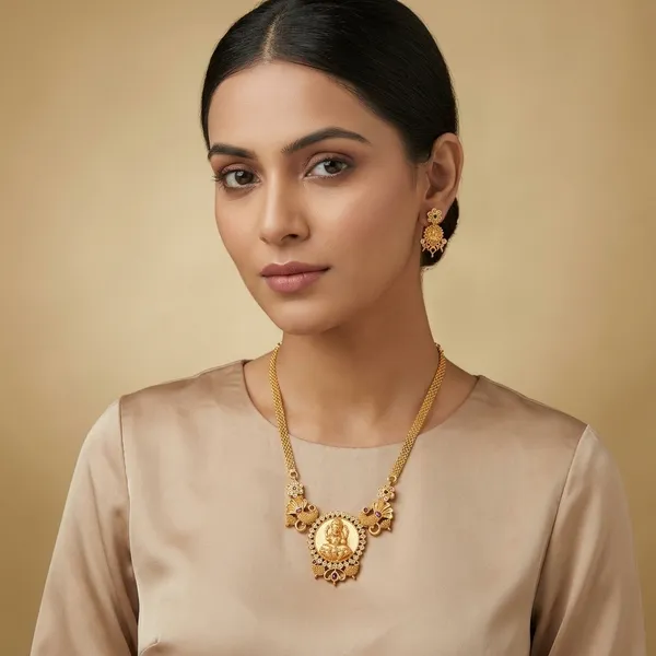 Gold_Tone_Lakshmi_Medallion_Necklace_Set_With_Peacock_Motifs_And_Floral_Stud_Earrings
