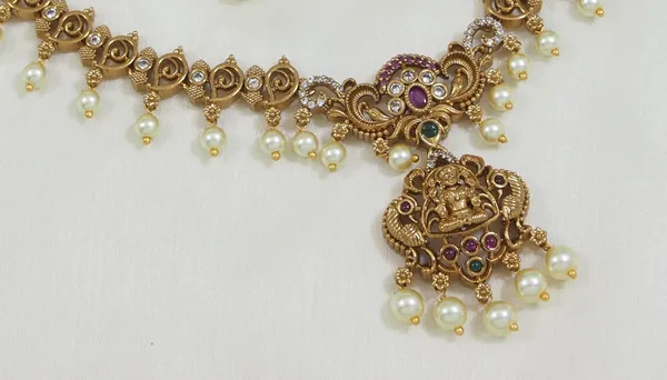 Matte_Finish_Brass_Necklace_Set_With_Lakshmi_Pendant,_American_Diamonds_&_Pearls