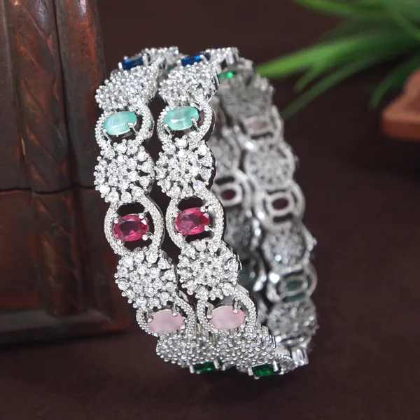Sparkling_Silver_Finish_Bangles_With_Multicolor_Stones_And_Floral_Design