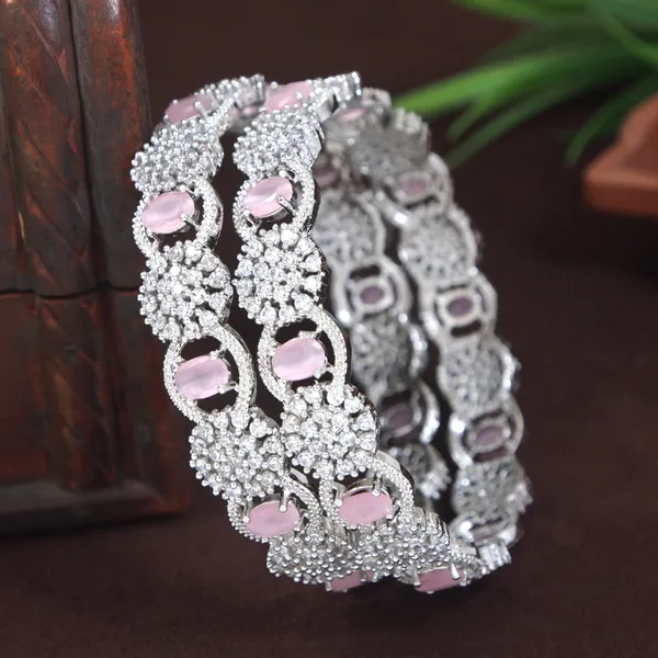 Sparkling_Silver_Finish_Bangles_With_Pink_White_Stones_And_Floral_Design