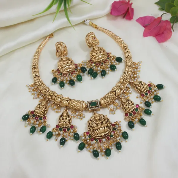 Traditional_Gold_Plated_Temple_Necklace_Set_With_Lakshmi_Motifs,_Green_&_Red_Stones,_And_Pearl_Accents