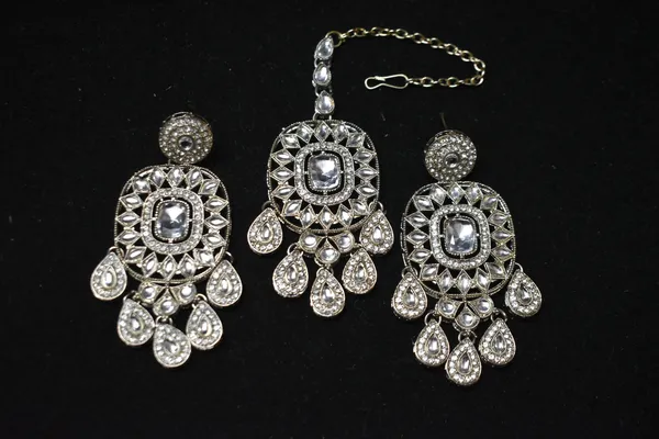 Silver_And_White_Alloy_Kundan_Danglers_With_Mangtika_For_Women