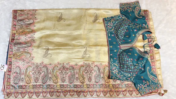 Cream_Paisley_Border_Silk_Saree_With_Teal_Embroidered_Blouse