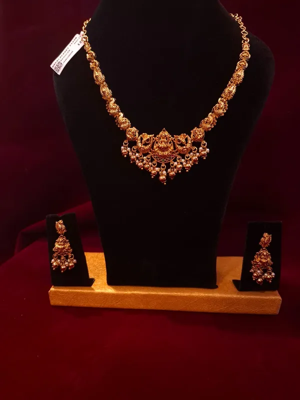 Antique_Gold_Metal_Temple_Lakshmi_Necklace_Set_With_Earrings_For_Women