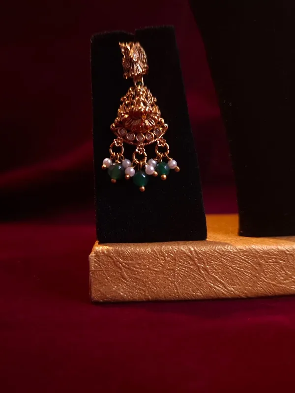 Gold_And_Green_Metal_Temple_Lakshmi_Necklace_Set_For_Women
