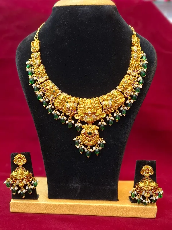 Gold_And_Green_Metal_Temple_Jewellery_Necklace_Set_For_Women