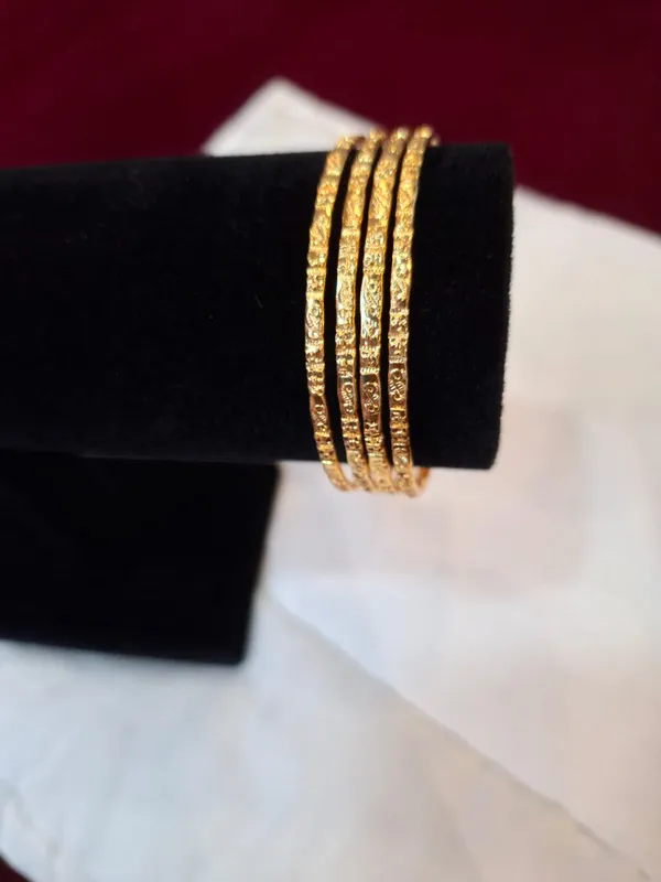 Gold_Metal_Textured_Bangle_Set_Of_4_For_Women