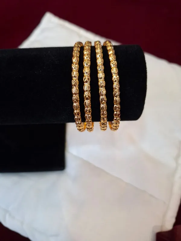 Gold_Metal_Textured_Bangle_Set_Of_4_For_Women