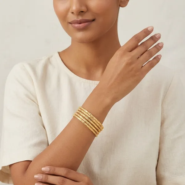 Gold_Metal_Textured_Bangle_Set_Of_4_For_Women