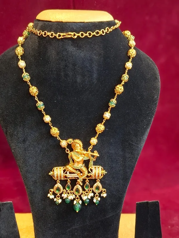 Gold_And_Green_Metal_Krishna_Pendant_Necklace_For_Women