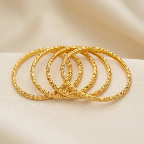 Gold_Metal_Textured_Bangle_Set_Of_4_For_Women