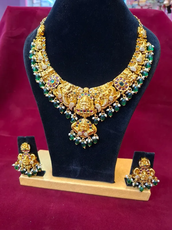 Gold_And_Green_Metal_Kundan_Temple_Necklace_Set_For_Women