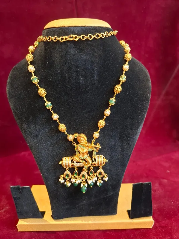 Gold_And_Green_Metal_Krishna_Pendant_Necklace_For_Women