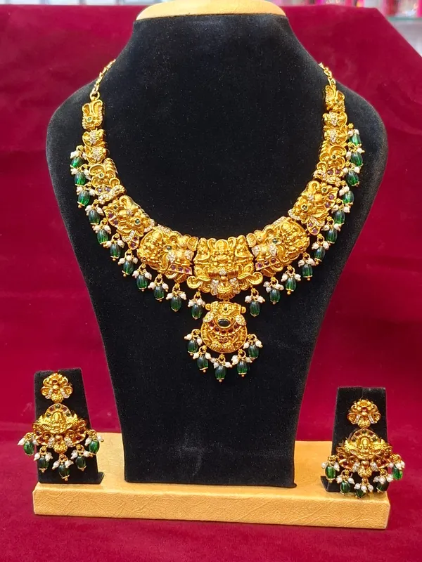 Gold_And_Green_Metal_Temple_Jewellery_Necklace_Set_For_Women