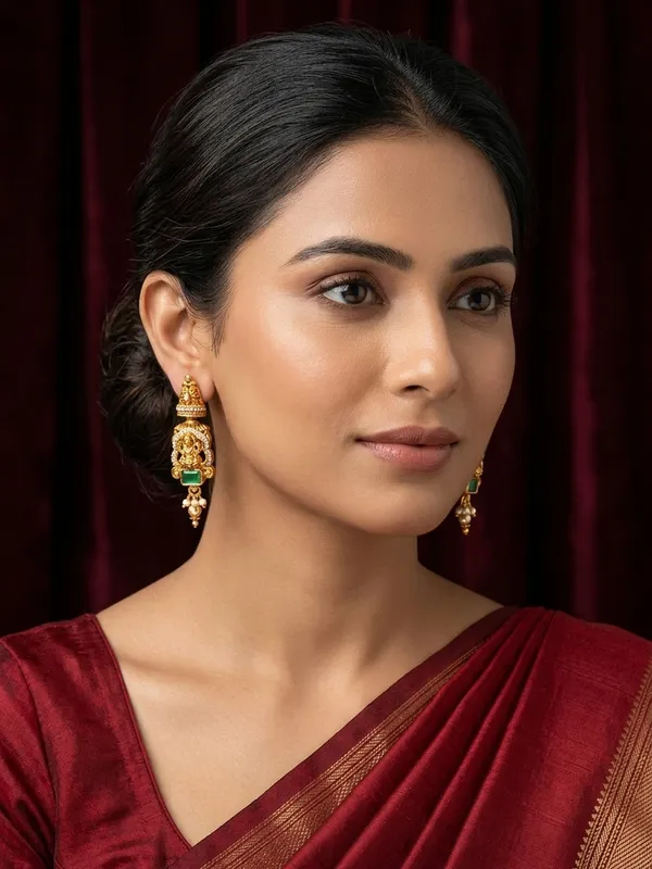 Traditional_Gold_Lakshmi_Temple_Earrings_with_Green_Stone_Accent