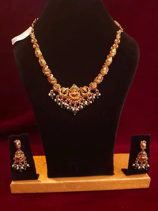 Gold_And_Green_Metal_Temple_Lakshmi_Necklace_Set_For_Women