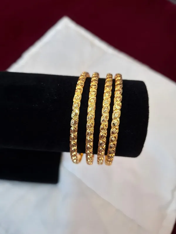 Gold_Metal_Textured_Bangle_Set_Of_4_For_Women