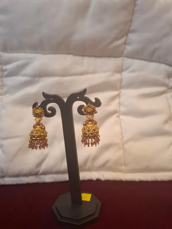 Gold_Antique_Metal_Jhumka_Earrings_With_Red_Beads