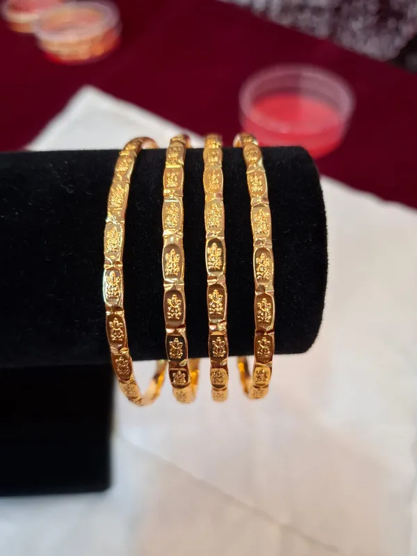 Gold_Metal_Textured_Bangle_Set_Of_4_For_Women